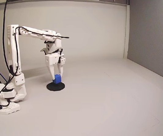 SO-101 arm placing a cube on a black disc